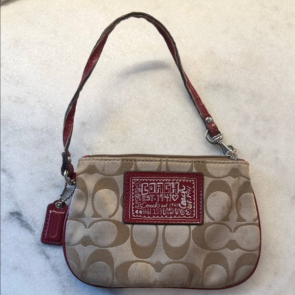 Coach Handbags - Coach Beige Canvas Wristlet with Red Trim and Patch